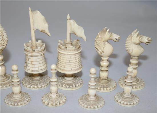 An early 19th century Anglo Indian green stained and plain ivory chess set, kings 4in.